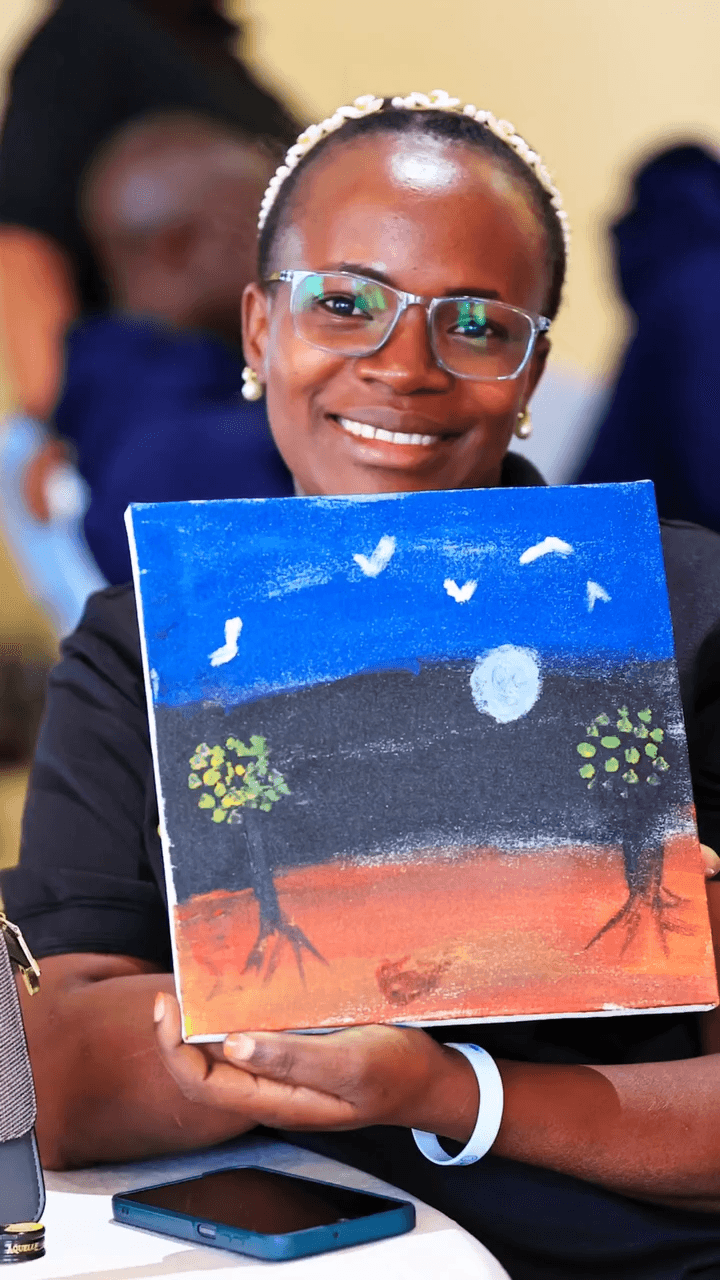 Participant with painting March 2026