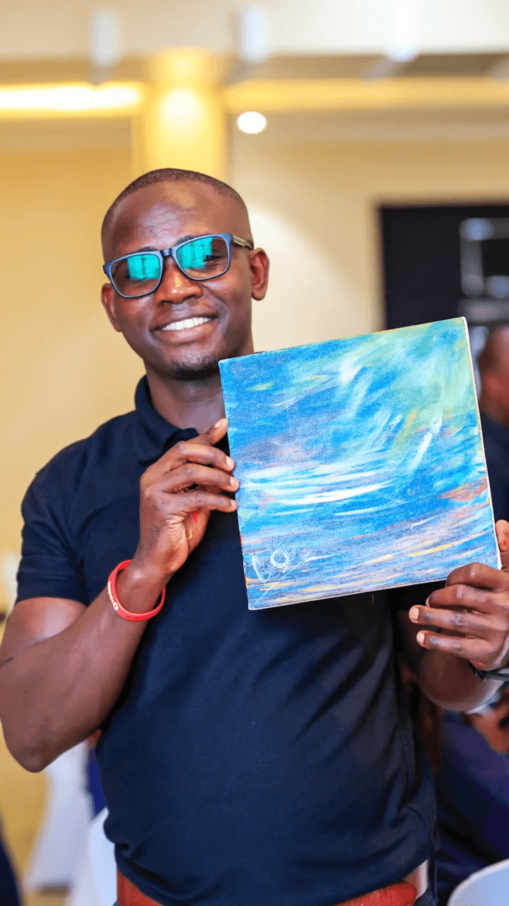 Participant with painting March 2026