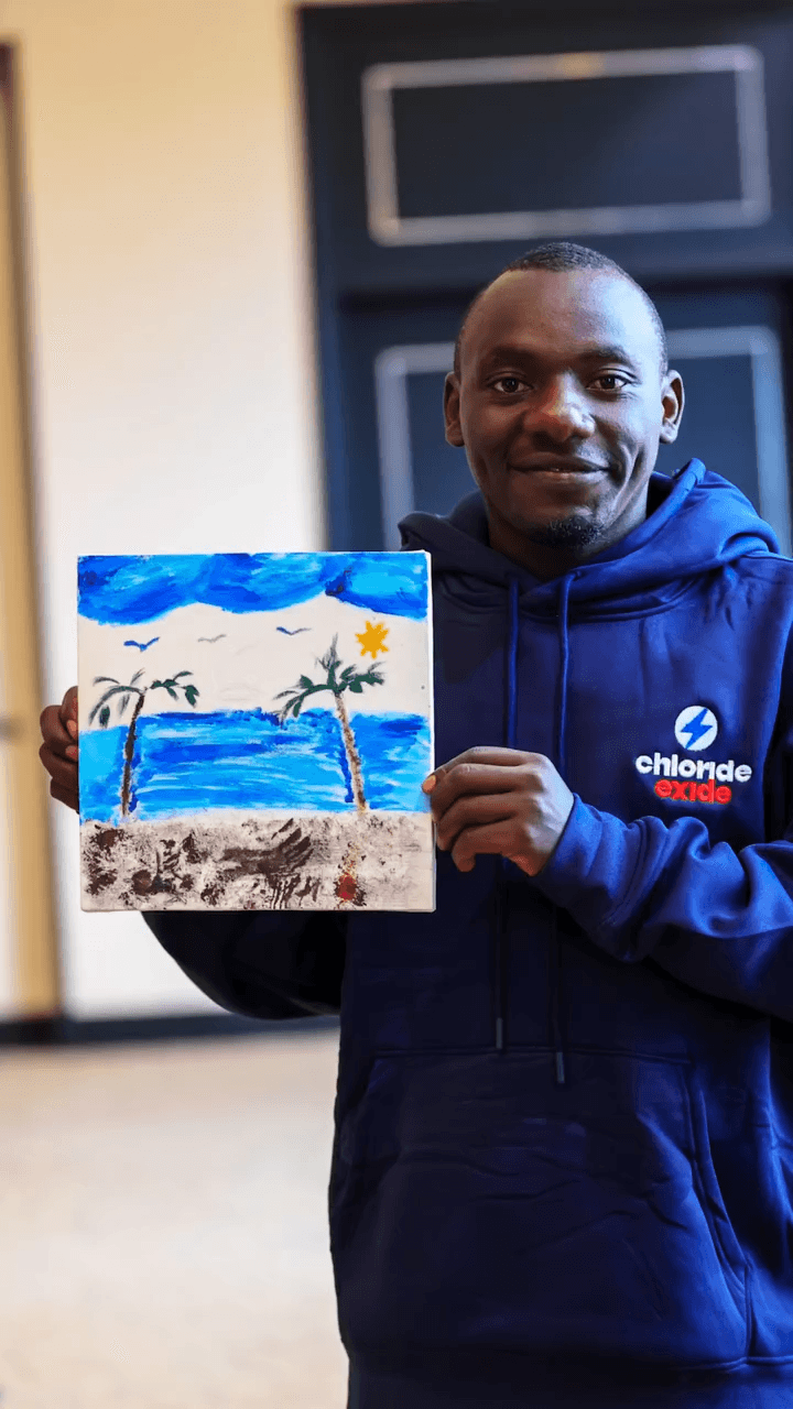 Participant with painting March 2026