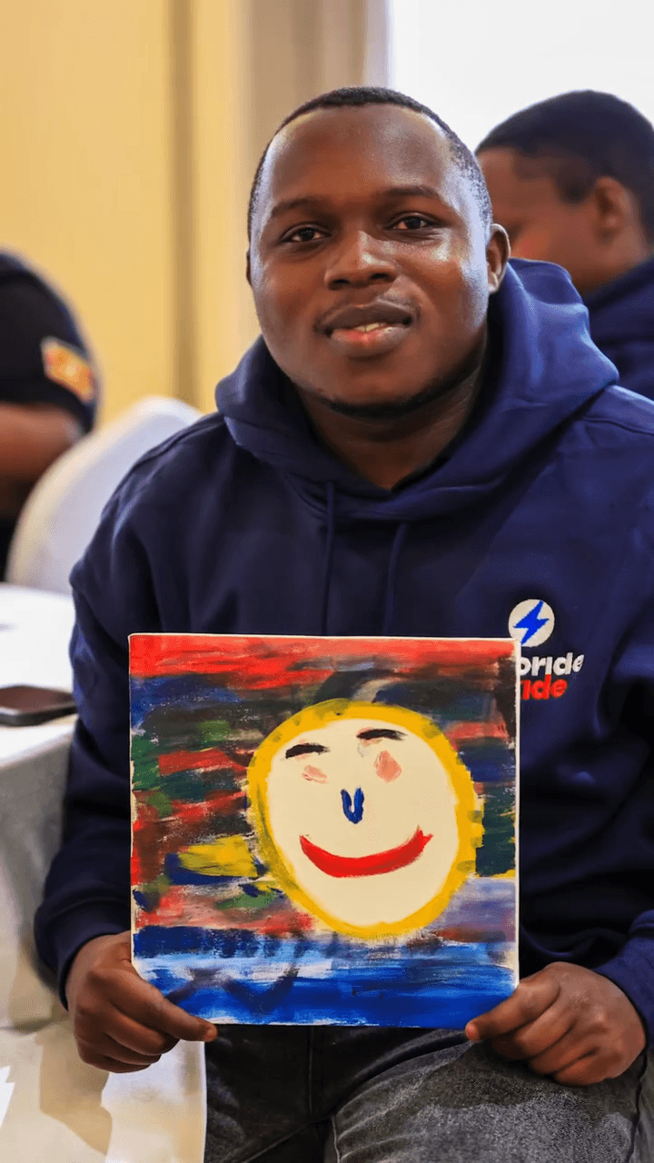 Participant with painting March 2026