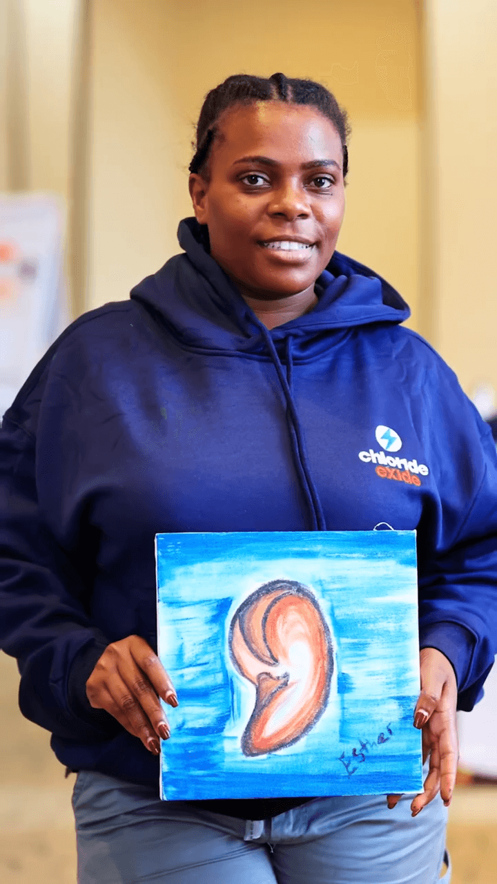 Participant with painting March 2026